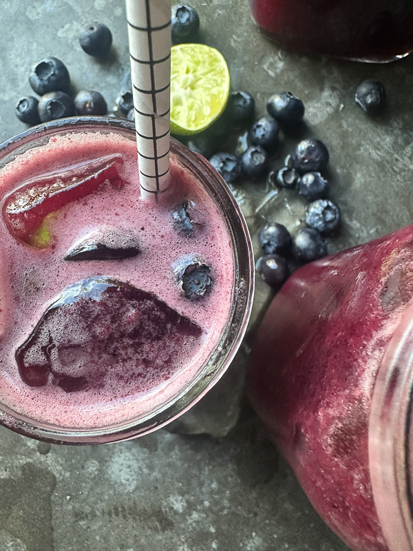 Blueberry Limeade is a refreshing drink that's great mixed with sparkling water or spirits! Find the recipe on Shutterbean.com