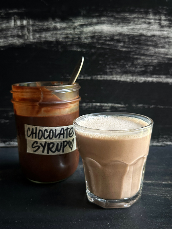 Make your own Homemade Chocolate Syrup in minutes! This easy, all-natural recipe is perfect for ice cream, milk, and coffee lovers alike. Save this for your next chocolate craving! Recipe on Shutterbean.com