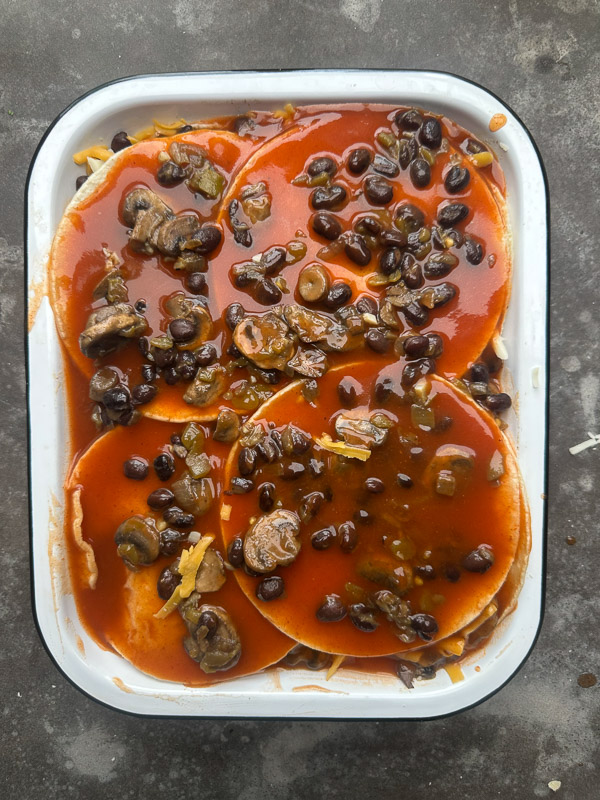 Looking for a delicious meatless meal? This Mushroom Enchilada Casserole is packed with savory mushrooms, cheesy goodness, and bold enchilada sauce. Perfect for weeknight dinners or meal prep! #VegetarianRecipe #EnchiladaCasserole #MushroomRecipes #EasyDinner #MeatlessMonday #Shutterbean