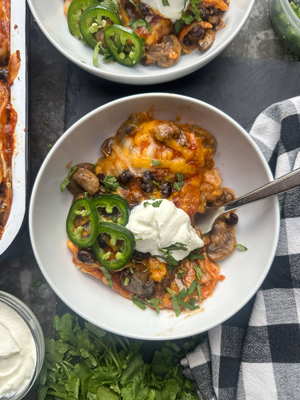 Looking for a delicious meatless meal? This Mushroom Enchilada Casserole is packed with savory mushrooms, cheesy goodness, and bold enchilada sauce. Perfect for weeknight dinners or meal prep! #VegetarianRecipe #EnchiladaCasserole #MushroomRecipes #EasyDinner #MeatlessMonday #Shutterbean